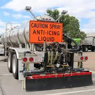 anti-icing truck with caution sign on the back